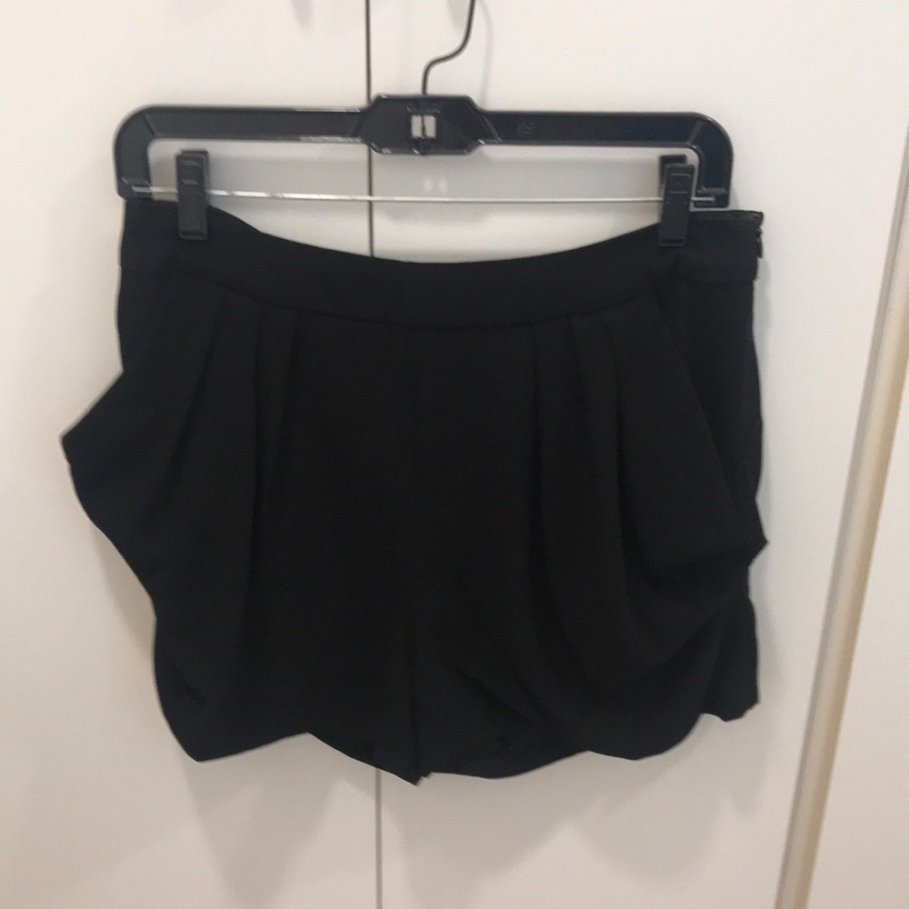 Black shorts with pleated pocket detail